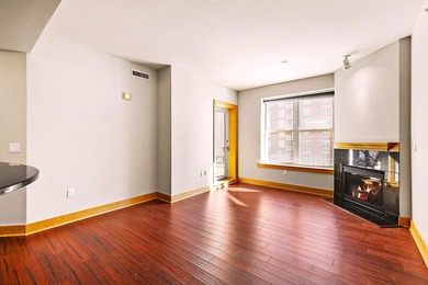 PRIME DOWNTOWN LOCATION WITH 2 ADJACENT PARKING SPACES!  Soak up