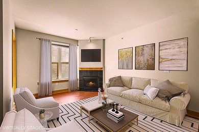 PRIME DOWNTOWN LOCATION WITH 2 ADJACENT PARKING SPACES!  Soak up