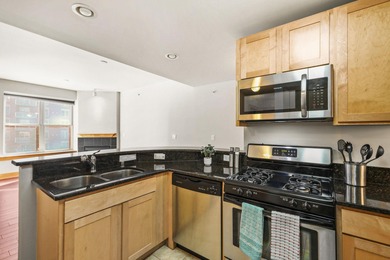 PRIME DOWNTOWN LOCATION WITH 2 ADJACENT PARKING SPACES!  Soak up