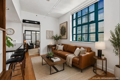 Experience elevated downtown living in this beautifully - photo 1