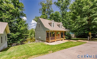 This beautiful lakefront home on over an acre features an open - photo 5