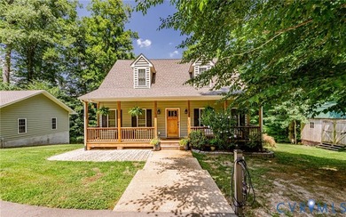 This beautiful lakefront home on over an acre features an open - photo 6