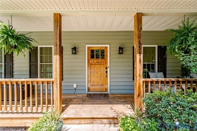This beautiful lakefront home on over an acre features an open - photo 7
