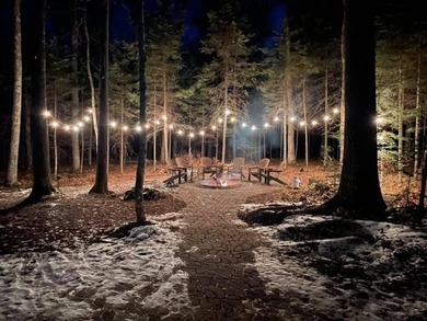 Custom-built Northwoods log sided home offering a rare, fully - photo 2
