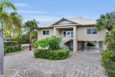This stately concrete home has all the best of everything on one - photo 2