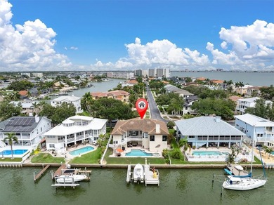 THIS CUSTOM-BUILT WATERFRONT RESIDENCE is elevated & offers an - photo 1
