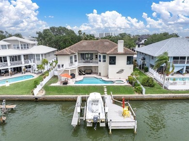 THIS CUSTOM-BUILT WATERFRONT RESIDENCE is elevated & offers an - photo 3