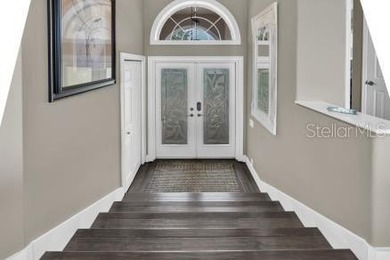 THIS CUSTOM-BUILT WATERFRONT RESIDENCE is elevated & offers an - photo 9