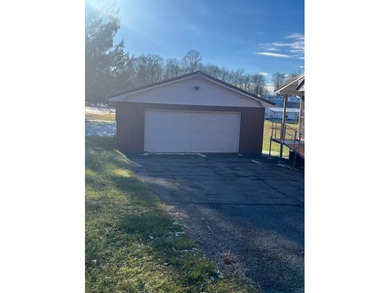 Opportunity awaits in this brick home located close to downtown