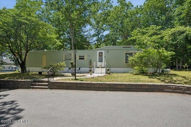 Welcome home! This stylish mobile home offers two bedrooms, a - photo 2