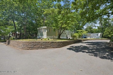 Welcome home! This stylish mobile home offers two bedrooms, a - photo 3