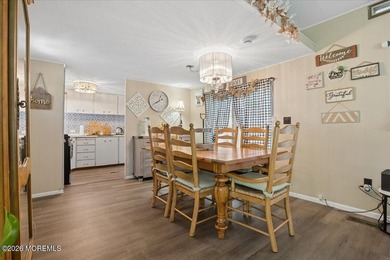 Welcome home! This stylish mobile home offers two bedrooms, a - photo 7