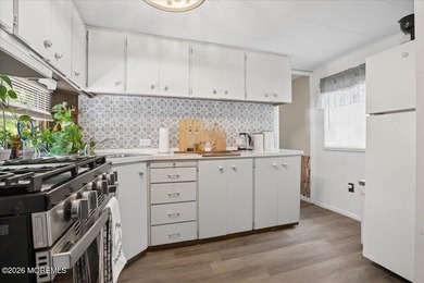 Welcome home! This stylish mobile home offers two bedrooms, a - photo 10