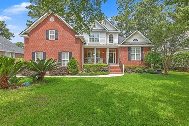 This stunning custom-built brick home in the prestigious gated - photo 2
