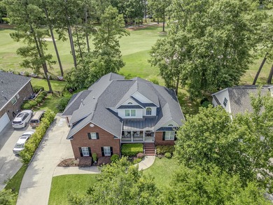 This stunning custom-built brick home in the prestigious gated - photo 4