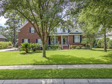 This stunning custom-built brick home in the prestigious gated - photo 6
