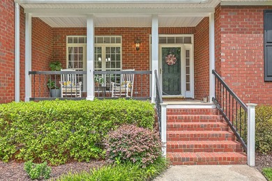 This stunning custom-built brick home in the prestigious gated - photo 7