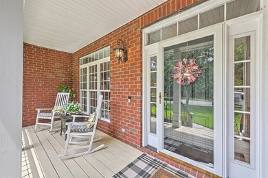 This stunning custom-built brick home in the prestigious gated - photo 8