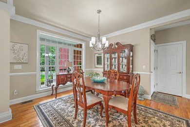 This stunning custom-built brick home in the prestigious gated - photo 10