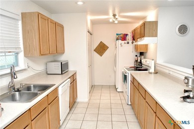 Nestled on a half-acre wooded lot in Rocky Creek Ranch, this - photo 4