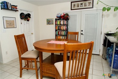Nestled on a half-acre wooded lot in Rocky Creek Ranch, this - photo 5