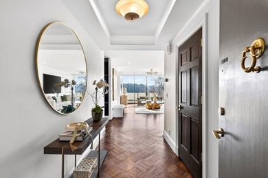 Originally configured as a three-bedroom, three-bath plan, this