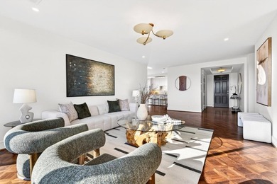 Originally configured as a three-bedroom, three-bath plan, this