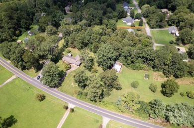 Well-maintained home on a spacious 3.28 acre corner lot in the