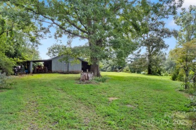Well-maintained home on a spacious 3.28 acre corner lot in the