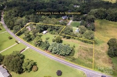 Well-maintained home on a spacious 3.28 acre corner lot in the