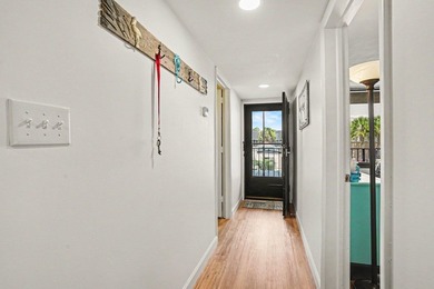 Just a short walk to the beach, this updated second-floor condo - photo 3