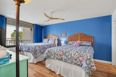Just a short walk to the beach, this updated second-floor condo - photo 5