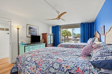 Just a short walk to the beach, this updated second-floor condo - photo 6
