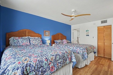 Just a short walk to the beach, this updated second-floor condo - photo 7