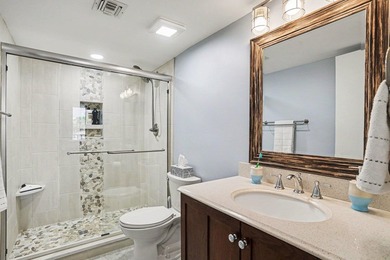 Just a short walk to the beach, this updated second-floor condo - photo 9
