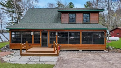 Experience Northwoods lake living at its finest on the - photo 2