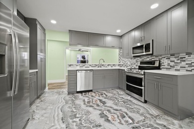 Discover this beautifully renovated 3-bedroom, 2-bath residence - photo 3