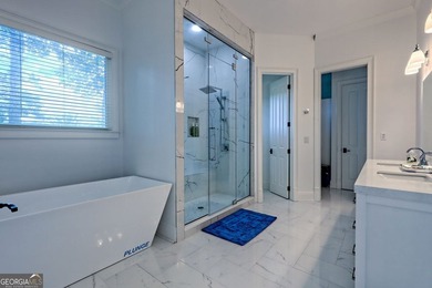 Nestled in the coveted Waterfall at Lake Burton community, this - photo 32