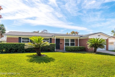Welcome home to this beautifully updated 3-bedroom, 2-bath brick - photo 3