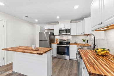 Welcome home to this beautifully updated 3-bedroom, 2-bath brick - photo 8