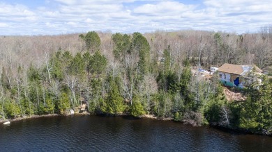 Beautifully wooded lakefront lot located on North Turtle Lake in - photo 2