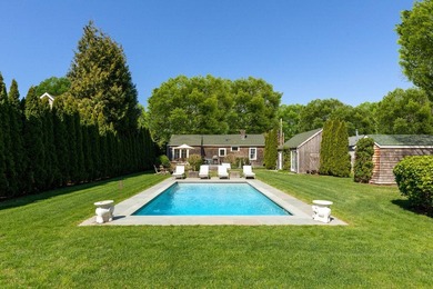 Set on a quiet street in Bellport Village, this charming Cape - photo 1