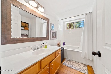 Tucked into two wooded acres of towering ponderosa pine, this is - photo 15