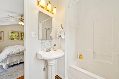 Tucked into two wooded acres of towering ponderosa pine, this is - photo 26