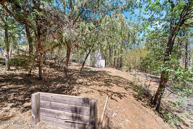 Tucked into two wooded acres of towering ponderosa pine, this is - photo 49