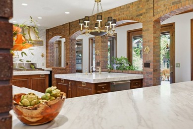 Perched behind a grand gated entrance and winding tree-lined - photo 11