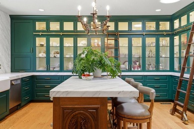 Perched behind a grand gated entrance and winding tree-lined - photo 13