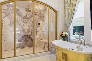 Perched behind a grand gated entrance and winding tree-lined - photo 19