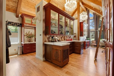 Perched behind a grand gated entrance and winding tree-lined - photo 20