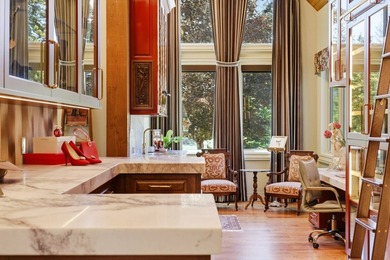 Perched behind a grand gated entrance and winding tree-lined - photo 21